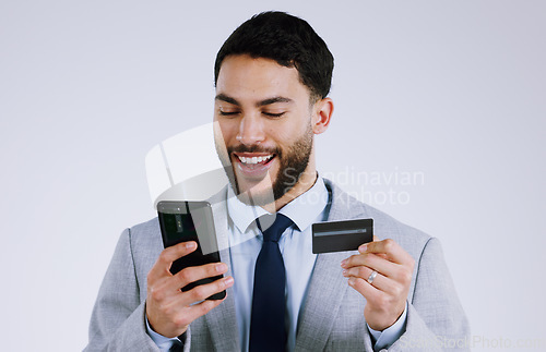 Image of Business man, credit card and phone for online shopping, e commerce or digital payment in studio. Professional worker typing on his mobile for internet banking or debit isolated on a white background