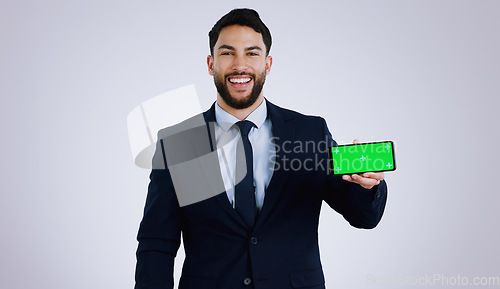 Image of Professional man, mobile green screen and space for social media, software or online subscription in studio. Portrait of business worker on phone, website mockup or contact info on a white background