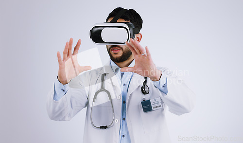 Image of Doctor, vision and virtual reality glasses for medical software, metaverse, futuristic technology and digital experience in studio. Healthcare man with 3d exam, hands and VR on a white background