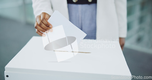 Image of Hand, ballot and box for vote paper at president election cast, poll station choice or government selection. Person, fingers and decision document or politics support or usa process, opinion at booth