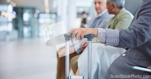 Image of Hand, suitcase and a business person in the airport for travel, waiting to board his international flight. Corporate, luggage and a professional employee in a terminal or lobby for a global trip