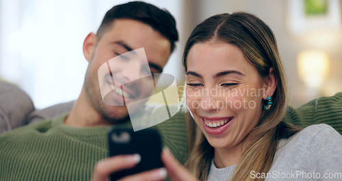 Image of Laugh, phone and couple on sofa for social media, internet and reading funny website together. Dating, home and happy man and woman on smartphone for meme and bonding, relax and love in living room