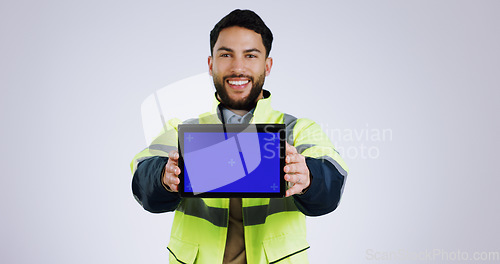 Image of Engineering man, tablet green screen and presentation for renovation, architecture and design software in studio. Portrait of construction worker with digital technology mockup on a white background