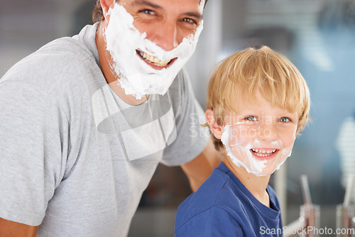 Image of Like father like son. A young boy and his father with faces full of shaving cream.