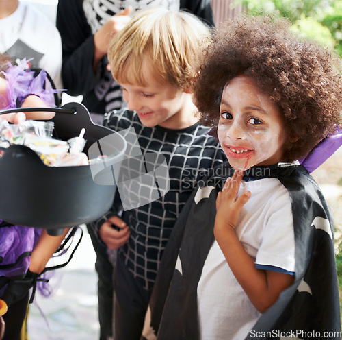 Image of So much candy. Little children trick-or-treating on halloween.