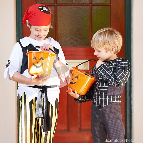 Image of We have so much. Little children trick-or-treating on halloween.