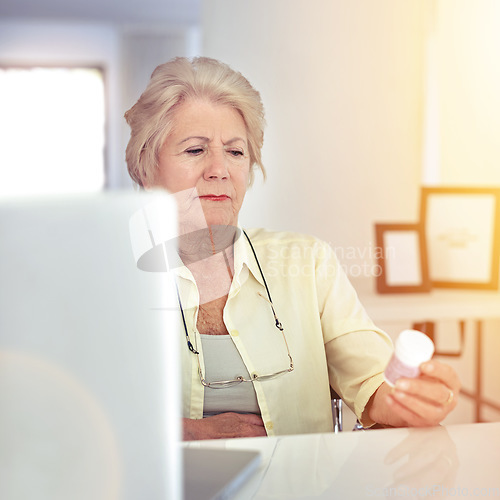 Image of Gathering information on the medicine the doctor prescribed her. a senior woman checking her medication at home.