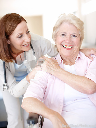 Image of Congratulating her on such a speedy recovery. Portrait of a mature nurse and her elderly patient sharing an affectionate moment together.