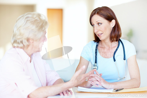 Image of What is the best course of action, doctor - Senior Health. An elderly woman expresses her concerns to a trusted doctor.