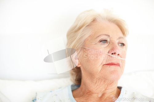 Image of A heavy heart - Illness. Ailing senior woman wearing a nasal cannula looks out of her hospital window thoughtfully - Copyspace.