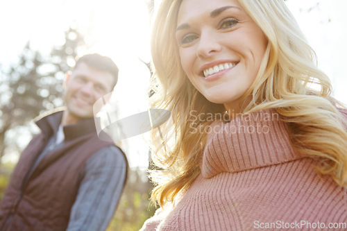 Image of She enjoys nature walks. A happy and loving couple spending time out in the woods together.