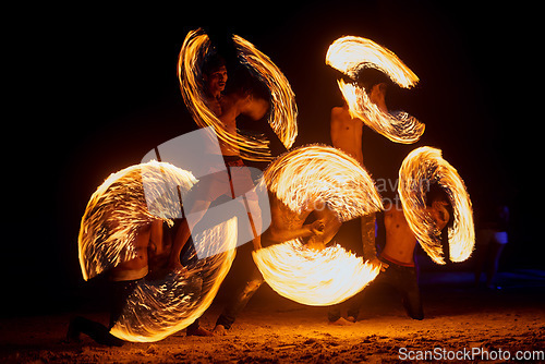 Image of Beachside entertainment. a fire performance on a beach in Thailand.