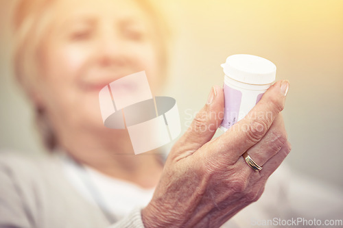 Image of Hand, medication and woman with bottle of pills for recovery and pharmaceutical healthcare. Medical, medicine and closeup of senior female person with container with prescription tablets or vitamins.