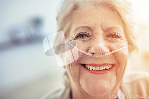 Image of Portrait, healthcare and recovery with a senior woman in her home after treatment at a hospital or clinic. Face, smile and medical tubes with a happy mature female patient looking healthy closeup