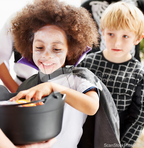 Image of They love halloween. Little children trick-or-treating on halloween.