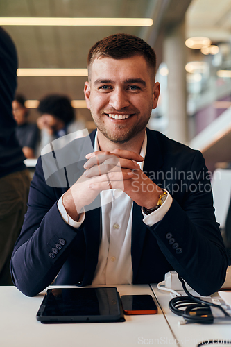 Image of In a modern office setting, a determined director sits confidently at his desk with crossed arms, exemplifying professionalism, leadership, and unwavering resolve in the contemporary corporate world