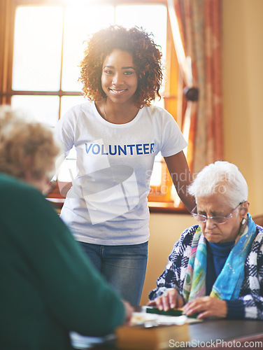 Image of Volunteering is its own reward. a volunteer working with seniors at a retirement home.