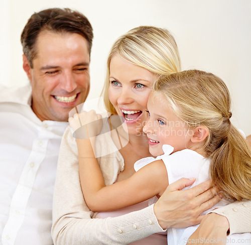 Image of They adore each other. Two delighted parents spending time with their adorable daughter.