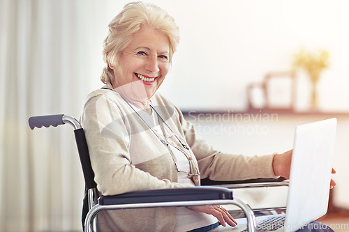 Image of The trick to aging gracefully is to enjoy it. a senior woman using a laptop while sitting in a wheelchair.