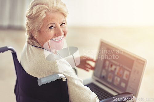 Image of Shes a tech-savvy senior. a senior woman using a laptop while sitting in a wheelchair.