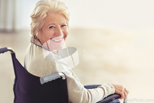 Image of Wrinkles merely mark where smiles have been. Cropped portrait of a senior woman in her wheelchair at home.