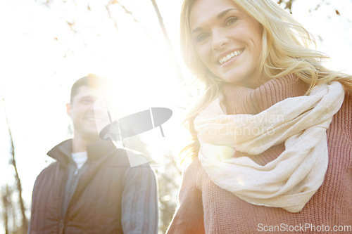 Image of Taking a walk in the woods. A happy and loving couple spending time out in the woods together.