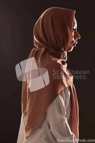 Image of Muslim woman, profile and hijab in faith for religion, islam or praise against a dark studio background. Side view of Islamic female person or model with scarf in fashion for culture or tradition