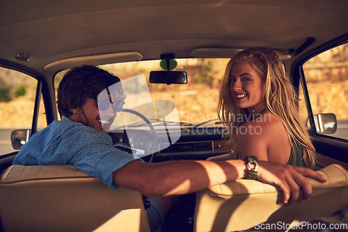 Image of Let us take you on an adventure. Rearview portrait of an affectionate young couple taking a roadtrip together.