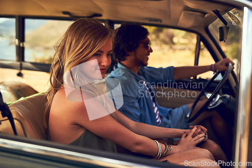 Image of She loves travelling with him. an affectionate young couple taking a roadtrip together.