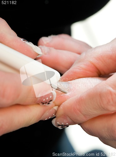 Image of Foot therapist working on a pair of feet 