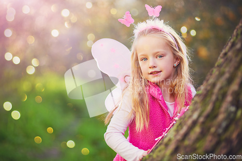 Image of The innocence of childhood. Portrait of an adorable little girl dressed up as a fairy and having fun outside.