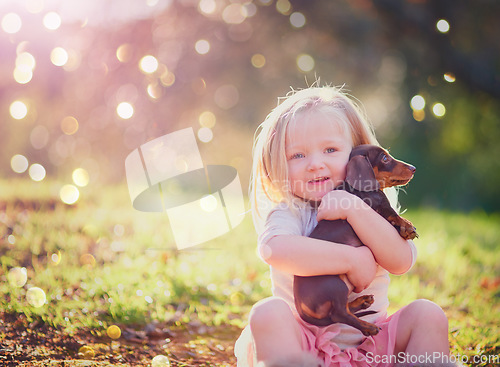 Image of Have you met my cute little pup. Portrait of an adorable little girl sitting with her puppy outside.