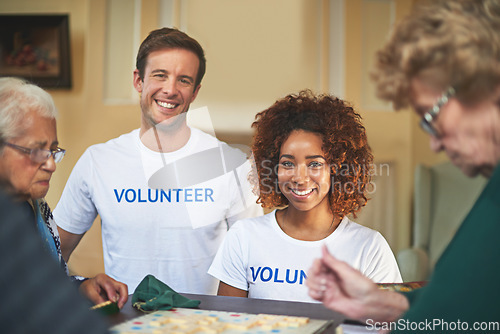 Image of Making a difference. Portrait of volunteers working with seniors at a retirement home.