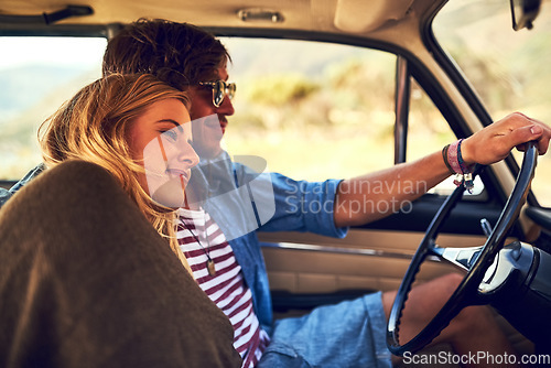 Image of Safe by his side. an affectionate young couple taking a roadtrip together.