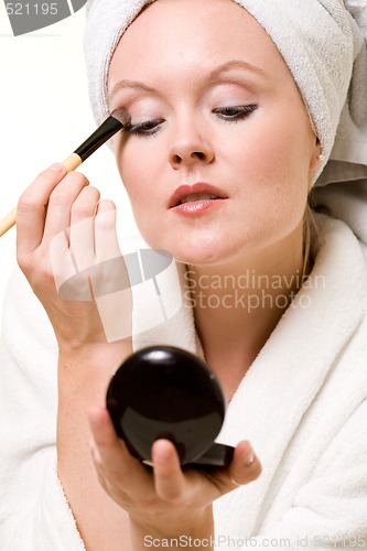 Image of Putting on makeup