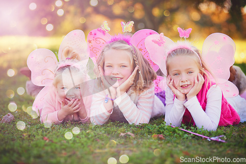 Image of Making their childhood even more magical. Portrait of three little sisters dressed up as fairies and having fun outside.