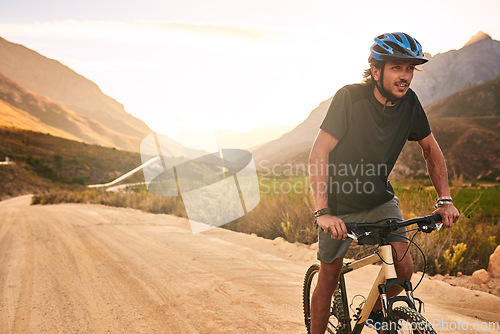 Image of Hes always on the lookout for new adventures. a young man cycling along a trail.