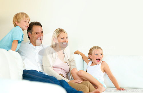 Image of They love spending time together. a loving family of four spending time together.