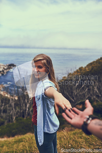 Image of Come with me. an affectionate young couple enjoying a hike in the mountains.