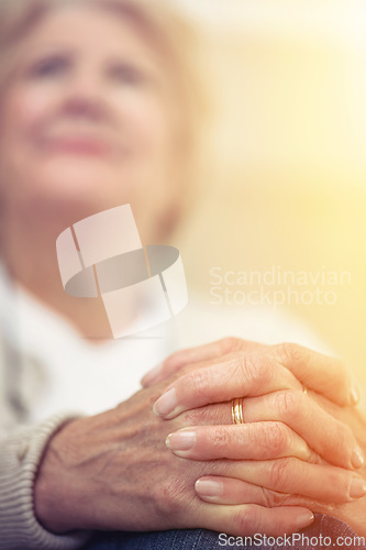 Image of Aging gracefully is a virtue. An elderly womans hands clasped together on her lap.