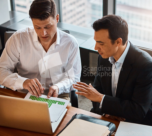 Image of You can have whatever you work for. two businessmen having a discussion while sitting by a laptop.