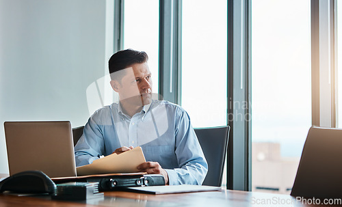 Image of Make sure you give it your best. a mature businessman working at his desk.