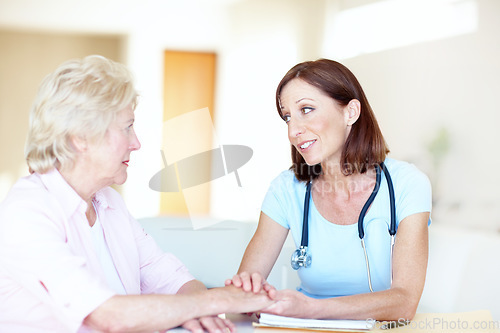 Image of Seeking comfort and advice from her trusted doctor - Senior Health. Mature doctor reassures her senior female patient with kind words.