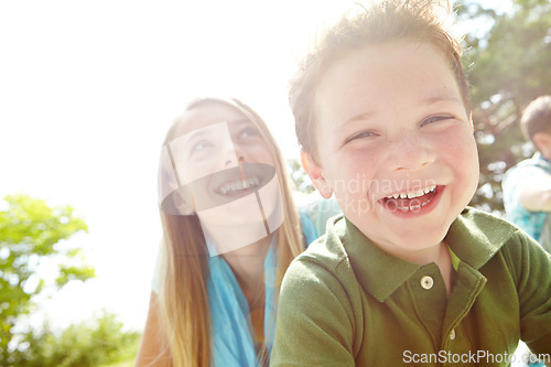 Image of Their future is filled with promise. Two young siblings sitting together in the park.