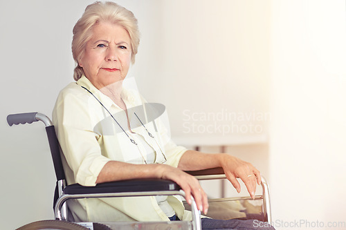 Image of Old age- the crown of life, our plays last act. Portrait of a senior woman in her wheelchair at home.