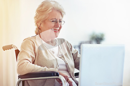 Image of Wireless web browsing on wheels. a senior woman using a laptop while sitting in a wheelchair.