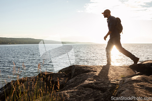 Image of Experience the true freedom of movement. a man wearing his backpack while out for a hike on a coastal trail.