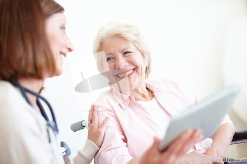 Image of Doctor delivers the good news - Senior Care. Elderly patient is delighted by the good news her nurse has just given her.