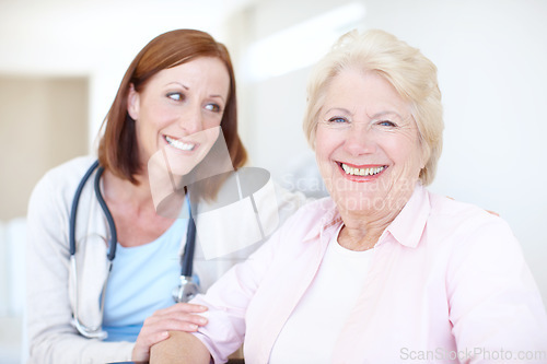 Image of Relieved and ecstatic about her clean diagnosis. Happy elderly female patient receives some welcome company from her nurse.