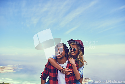 Image of They share a love of nature. an affectionate young couple enjoying a hike in the mountains.